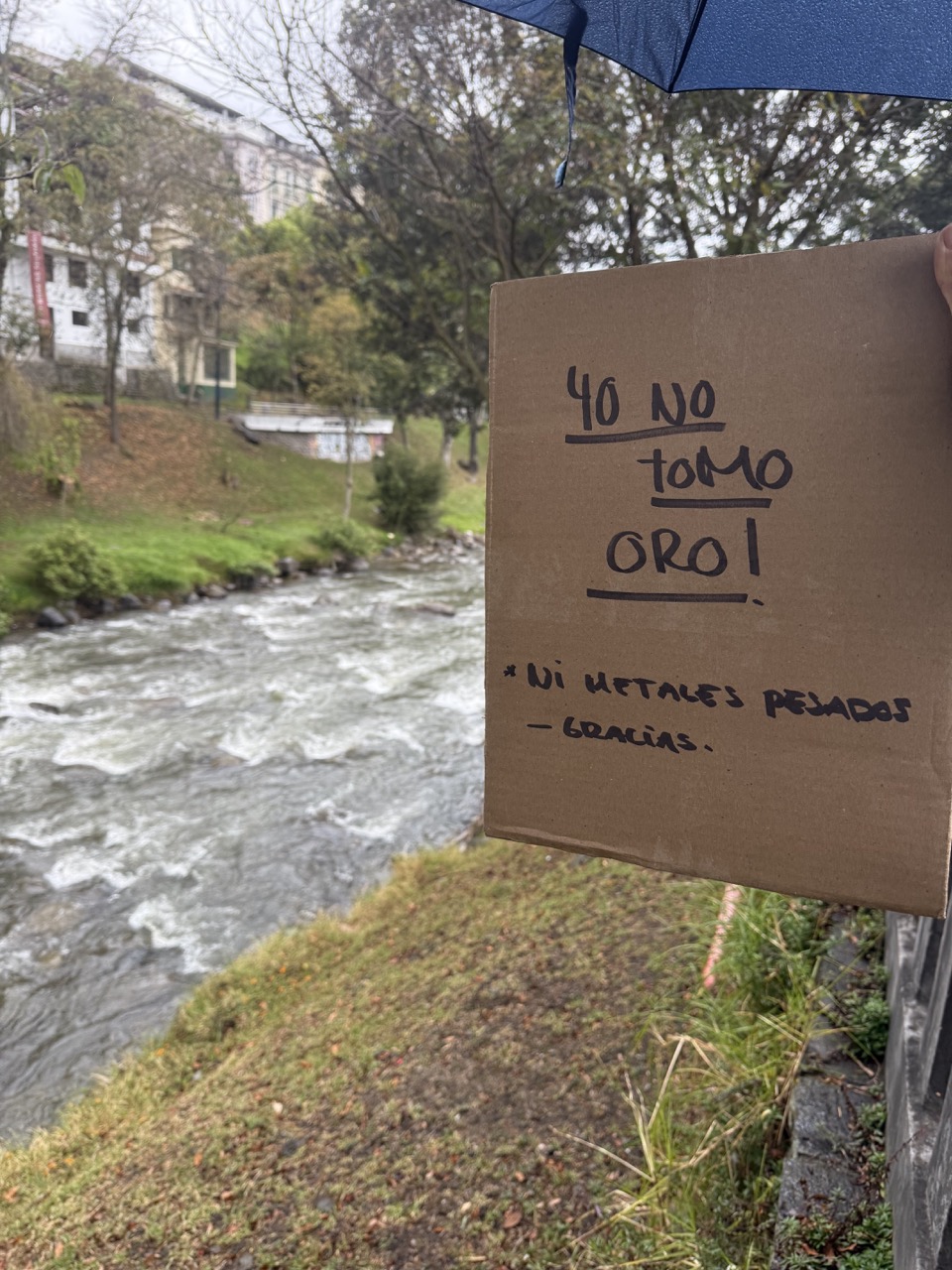 People holding water banners in Cuenca march